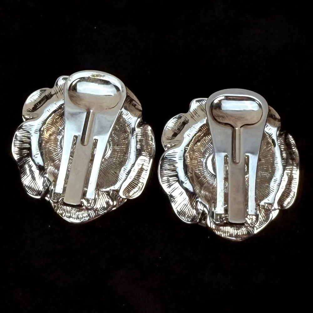 Vintage Nolan Miller, goldtone and silvertone weighted flower clip on earrings